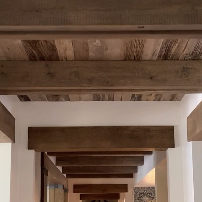 Reclaimed Wood Trusses Installed on Ceiling of Residence